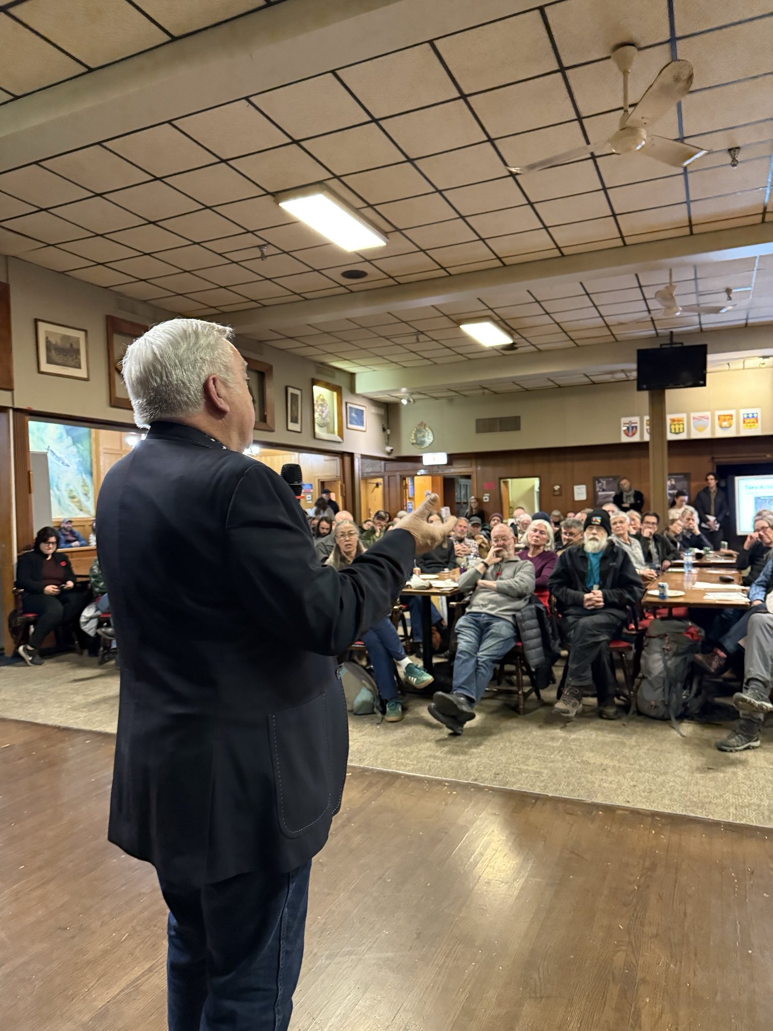 Speaker addressing 185 Calgarians at town hall about oil well cleanup scam and coal mining threats