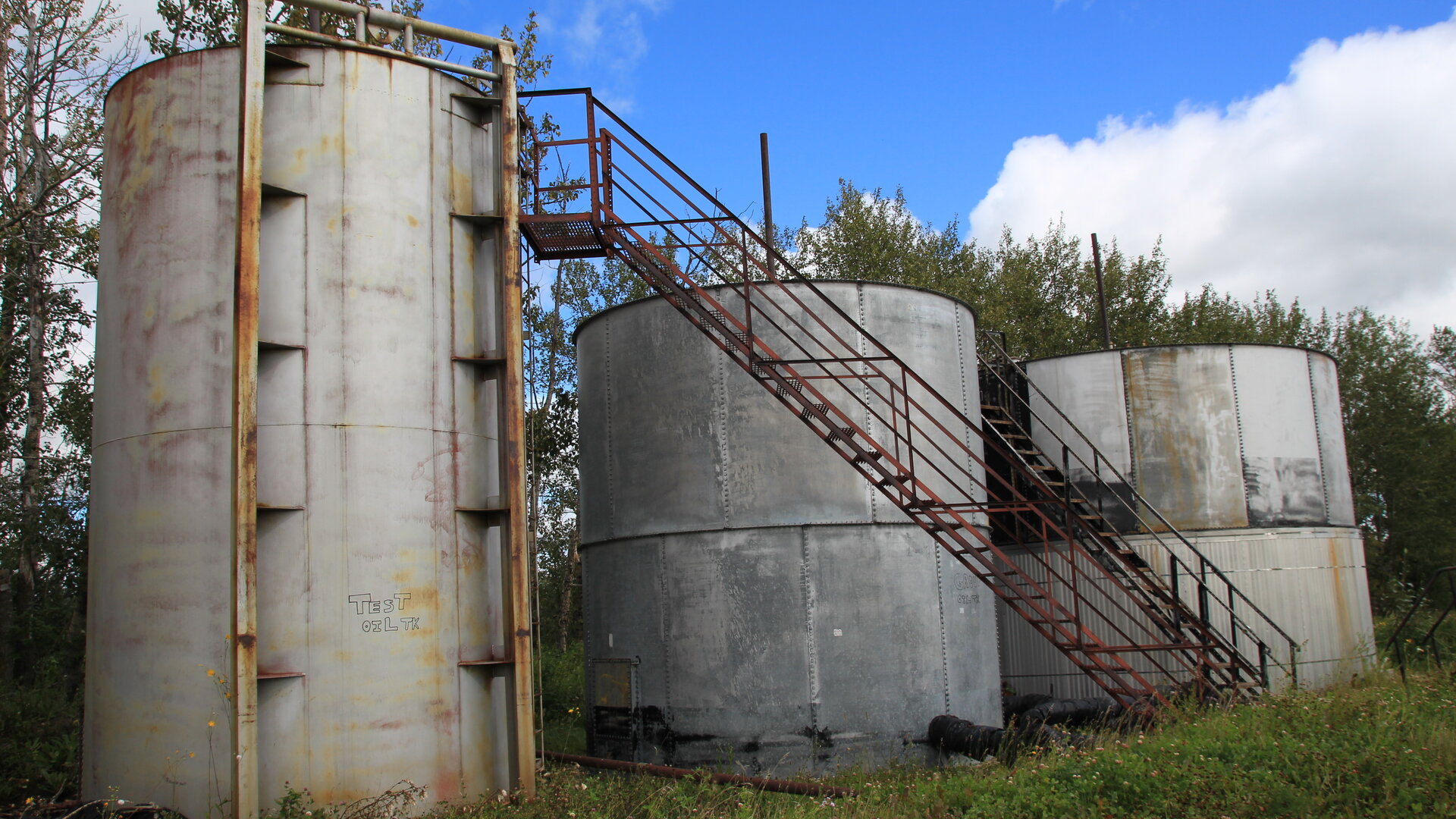 Aging oil storage tanks in rural Alberta - visual evidence of the industry's aging infrastructure scam